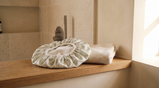 Woman wearing an Esteam luxury shower cap