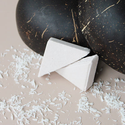 Esteam shower steamer with coconut on a white background