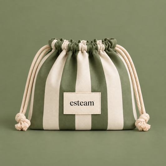 Esteam striped drawstring make-up bag in sage green and cream, closed, front view