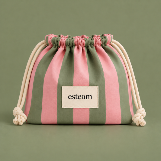 Esteam striped drawstring make-up bag in pink and sage green, closed, front view