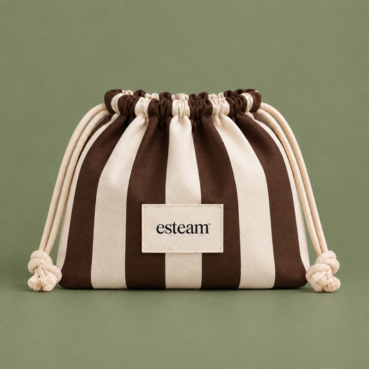 Esteam striped drawstring make-up bag in cocoa brown and cream, closed, front view
